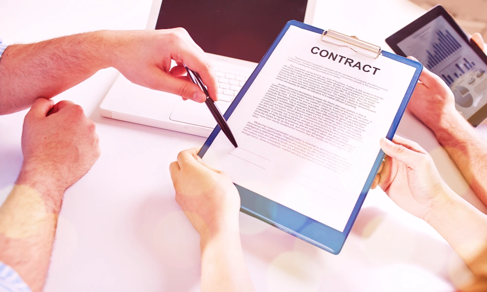 GDP Training - Outsourced Activities - Blog - close-up-businessman-signing-contract